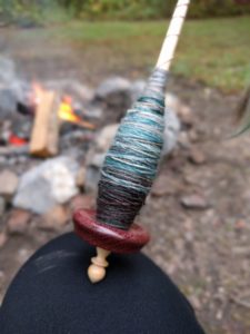 spinning yarn by the campfire